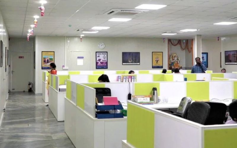 Team executing social media management and content creation services in a business office environment