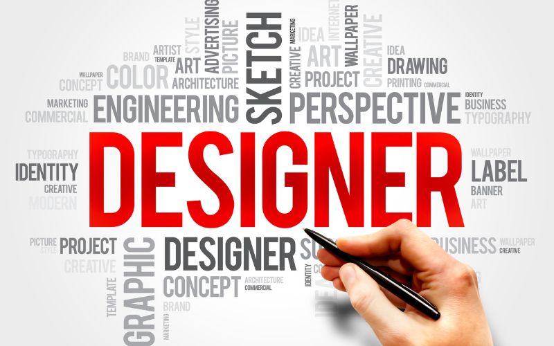hand holding pen pointing at bold designer text surrounded by words like typography identity and sketch representing key concepts in logo design